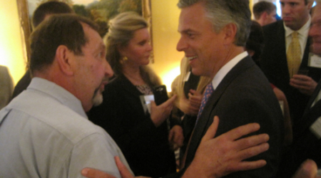 Jon Huntsman, left, speaks with D.C. activist Nelson Rimensnyder, as Georgetowner Maureen Agron, center, stands by