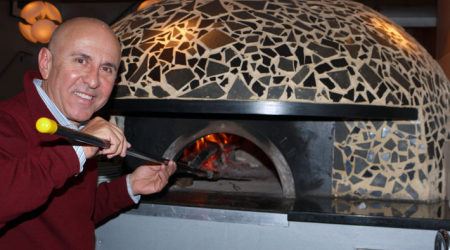 Giuseppe Joe Farruggion with his ceramic-tiled pizza oven