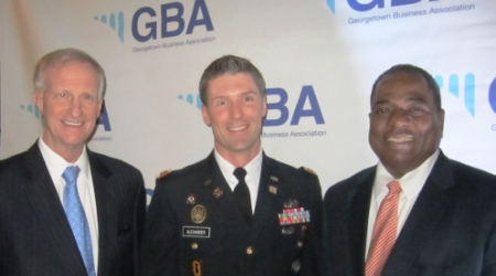 Major David Alexander, US Army, is flanked by Councilmembers Jack Evans and Vincent Orange
