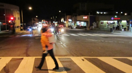 Looking south at Wisconsin Ave and Calvert St as a pedestrian crosses