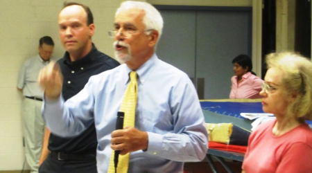 Peter Gosselin (center) argues against the ANC vote, with Richard Graham and Wanda Reit as his side