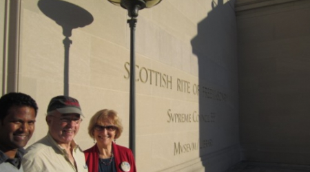 Tour volunteers Kishan Putta, Bill Elcome and Jacqueline Rose in front of the Scottish Rite Temple