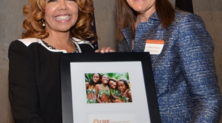 Rep.-elect Lucy McBath (L) is presented with CARE Global Leaders Network award Michele Flournoy