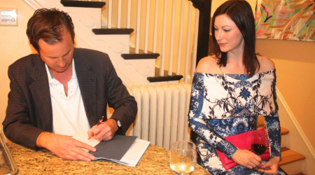 John Tamny greets guests