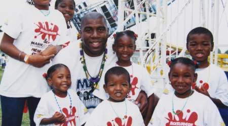 Magic Johnson surrounded by kids