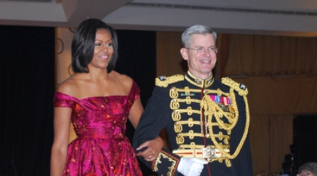 First Lady Michelle Obama on the arm of military escort