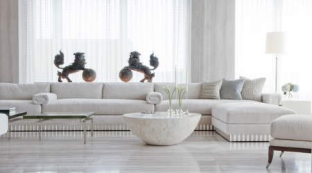 Living room features travertine floor and walls, a waxed Venetian-plaster ceiling and custom-made sofa.