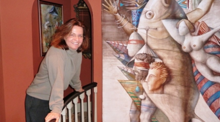 Claudine on spiral staircase with Panayotov painting