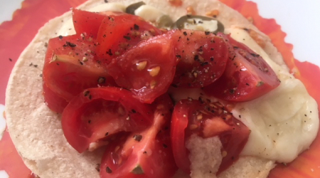 Easy Tacos with Light Cheese, Chopped Tomatoes, Onions, and Jalapeno Peppers