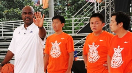 Coach John Thonpson III instructs youth in China