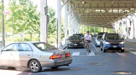 The removal of metered parking spaces below the Whitehurst Freeway would allow a dedicated bike lane.